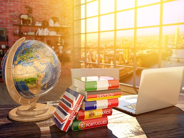 Globe and foreign dictionaries representing translation services for international companies